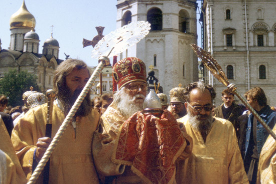 Bishop Basil in the Kremlin carrying the holy fire from Jerusalem, May 1991.