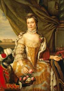 Painted here in her youth, HM Queen Charlotte of Mecklenburg--Strelitz (1744-1818), consort of George III from 1760-1818, was the second-longest serving royal consort in British history after Queen Elizabeth II's still-living husband HRH Prince Philip, Duke of Edinburgh. The Queen was an amateur botanist who devoted considerable energies to restoring the Kew Gardens and gardens of St James' Palace, the centre of the Royal Court. She and the King were devoted to each other; George III never took a mistress. Their Majesties had 15 children, of which 13 survived to adulthood.
